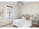 Bright bedroom with a queen-size bed and ceiling fan at 10648 E Greythorn Dr, Scottsdale, AZ 85262