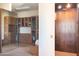 Spacious Primary closet with built-ins and private elevator access at 10648 E Greythorn Dr, Scottsdale, AZ 85262