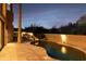 Expansive pool with a tranquil waterfall and desert landscape views at 10648 E Greythorn Dr, Scottsdale, AZ 85262