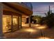 Lighted pathway leading to the home with desert landscaping at 10648 E Greythorn Dr, Scottsdale, AZ 85262