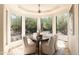 Bright breakfast nook with large windows and a view of the backyard at 10648 E Greythorn Dr, Scottsdale, AZ 85262
