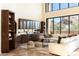 Open great room featuring a built-in bar and sectional sofa at 10648 E Greythorn Dr, Scottsdale, AZ 85262