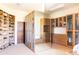 Large walk-in closet with ample shelving and custom built-ins at 10648 E Greythorn Dr, Scottsdale, AZ 85262