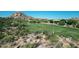 Luxury homes and a golf course are visible in this aerial view at 10648 E Greythorn Dr, Scottsdale, AZ 85262