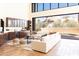 Open concept great room showcasing a wet bar and comfortable seating at 10648 E Greythorn Dr, Scottsdale, AZ 85262