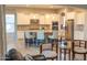 Elegant kitchen with an island, white cabinets, stainless steel appliances, and granite countertops at 27002 W Oraibi Dr, Buckeye, AZ 85396