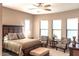 Spacious bedroom with plush bedding and seating area at 27002 W Oraibi Dr, Buckeye, AZ 85396