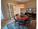 Roomy dining area with a round table, four chairs, and French doors leading to another room at 27002 W Oraibi Dr, Buckeye, AZ 85396