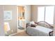 Bedroom with daybed and en-suite bathroom access at 27002 W Oraibi Dr, Buckeye, AZ 85396