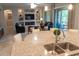 Island kitchen with granite countertops, stainless steel appliances, and ample cabinet space at 27002 W Oraibi Dr, Buckeye, AZ 85396