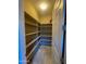Walk-in pantry with adjustable shelving for ample storage at 27002 W Oraibi Dr, Buckeye, AZ 85396