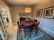 Bright dining room features a round table with seating for four and a stylish rug at 27002 W Oraibi Dr, Buckeye, AZ 85396