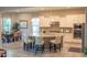 Modern kitchen with an island, white cabinets, stainless steel appliances, and granite countertops at 27002 W Oraibi Dr, Buckeye, AZ 85396