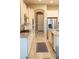 Bright kitchen with white cabinets, granite countertops, and stainless steel appliances at 27002 W Oraibi Dr, Buckeye, AZ 85396