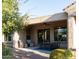 Covered patio with seating area and desert landscaping at 27002 W Oraibi Dr, Buckeye, AZ 85396