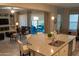 Open concept kitchen with granite island, stainless steel appliances, and views to Gathering room at 27002 W Oraibi Dr, Buckeye, AZ 85396