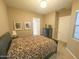 Bedroom with queen bed and en-suite bathroom at 27002 W Oraibi Dr, Buckeye, AZ 85396