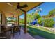 Covered patio with seating area, overlooking the backyard at 2544 E Denton Ln, Phoenix, AZ 85016