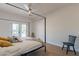 Bedroom with canopy bed, french doors, and ceiling fan at 3939 S Veronica Ln, Gold Canyon, AZ 85118