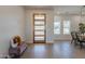 Light and bright entryway with wood door and bench, showcasing modern design at 3939 S Veronica Ln, Gold Canyon, AZ 85118