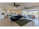 Spacious living room with sectional sofa, large windows and view to backyard at 3939 S Veronica Ln, Gold Canyon, AZ 85118