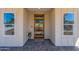 Modern house entrance with a wood door and stone flooring at 3939 S Veronica Ln, Gold Canyon, AZ 85118