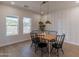 Modern dining room featuring a wood table, black chairs, and stylish light fixtures at 3939 S Veronica Ln, Gold Canyon, AZ 85118