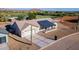 Aerial view of a single-story home with a metal roof and attached garage at 3939 S Veronica Ln, Gold Canyon, AZ 85118