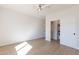 Bedroom with wood floor, closet, and ceiling fan at 3939 S Veronica Ln, Gold Canyon, AZ 85118