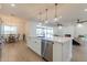 Kitchen island with sink, dishwasher, and breakfast bar seating at 3939 S Veronica Ln, Gold Canyon, AZ 85118