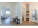 Bright entryway with built-in shelving and a half bathroom at 3939 S Veronica Ln, Gold Canyon, AZ 85118