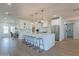 Open concept kitchen with island, stainless steel appliances, and white cabinetry at 3939 S Veronica Ln, Gold Canyon, AZ 85118