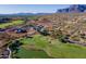 Aerial view of homes near a golf course and lake at 3939 S Veronica Ln, Gold Canyon, AZ 85118