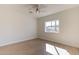 Bedroom with wood flooring, window, and ceiling fan at 3939 S Veronica Ln, Gold Canyon, AZ 85118