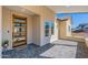 Modern house entrance with a wood door and stone flooring at 3939 S Veronica Ln, Gold Canyon, AZ 85118