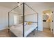 Bedroom with canopy bed and ensuite bathroom at 3939 S Veronica Ln, Gold Canyon, AZ 85118