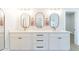 Modern bathroom with double vanity, white cabinets, and oval mirrors at 3939 S Veronica Ln, Gold Canyon, AZ 85118