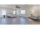 Spacious main bedroom with ceiling fan, large windows, and plush seating at 3939 S Veronica Ln, Gold Canyon, AZ 85118