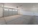 Large garage with concrete floor and automatic door opener at 3939 S Veronica Ln, Gold Canyon, AZ 85118