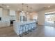 Modern kitchen with white cabinets, large island, and stainless steel appliances at 3939 S Veronica Ln, Gold Canyon, AZ 85118