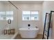 Spa-like bathroom with soaking tub, glass shower, and wood-look floors at 3939 S Veronica Ln, Gold Canyon, AZ 85118