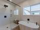 Spa-like bathroom with soaking tub, glass shower, and wood-look floors at 3939 S Veronica Ln, Gold Canyon, AZ 85118