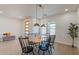 Dining area with a light wood table and black chairs, and a modern aesthetic at 3939 S Veronica Ln, Gold Canyon, AZ 85118