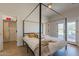Bedroom with canopy bed, access to private bathroom, and walk-in closet at 3939 S Veronica Ln, Gold Canyon, AZ 85118