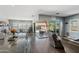 Open concept living room with a view of the pool and kitchen at 10737 E Simone Ave, Mesa, AZ 85212