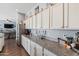 Kitchen with white cabinets, granite countertops, and ample storage at 10737 E Simone Ave, Mesa, AZ 85212