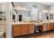 Spacious bathroom with double sinks and light wood cabinets at 10737 E Simone Ave, Mesa, AZ 85212