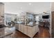 Open kitchen with granite island, stainless steel appliances, and breakfast bar at 10737 E Simone Ave, Mesa, AZ 85212