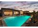 Inviting backyard oasis with a sparkling pool and patio area at 10737 E Simone Ave, Mesa, AZ 85212