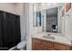 Bathroom with single sink vanity, toilet and shower/tub combo at 10737 E Simone Ave, Mesa, AZ 85212